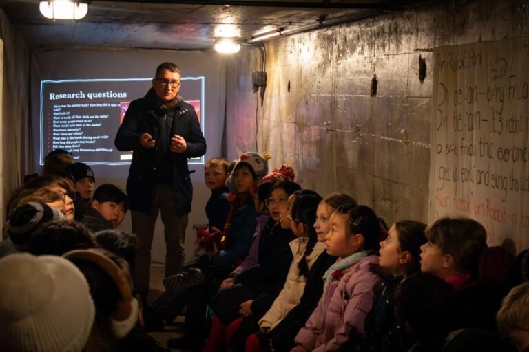 Professor Reynolds teaching children inside the Abbey Circus WW2 air-raid shelter